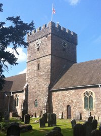 The memorial clock faces visible on the Church tower &copy; Shirenewton Community Council, 2014